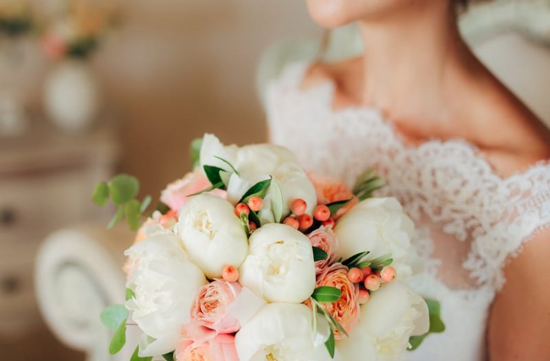 Closeup on bride and flowers during a Vermont Elopement at one of the best wedding venues in Vermont